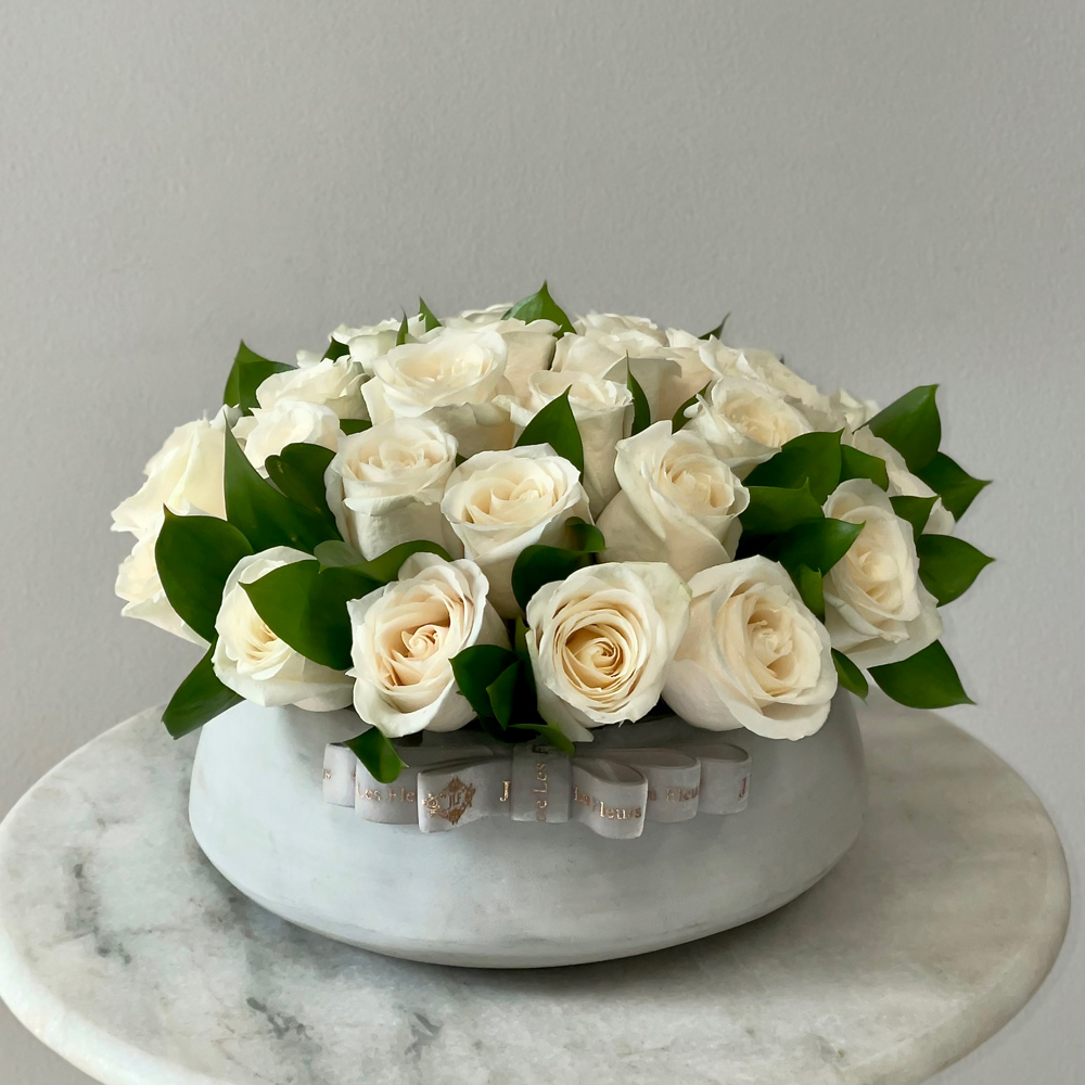 White Roses in a Ceramic Vase