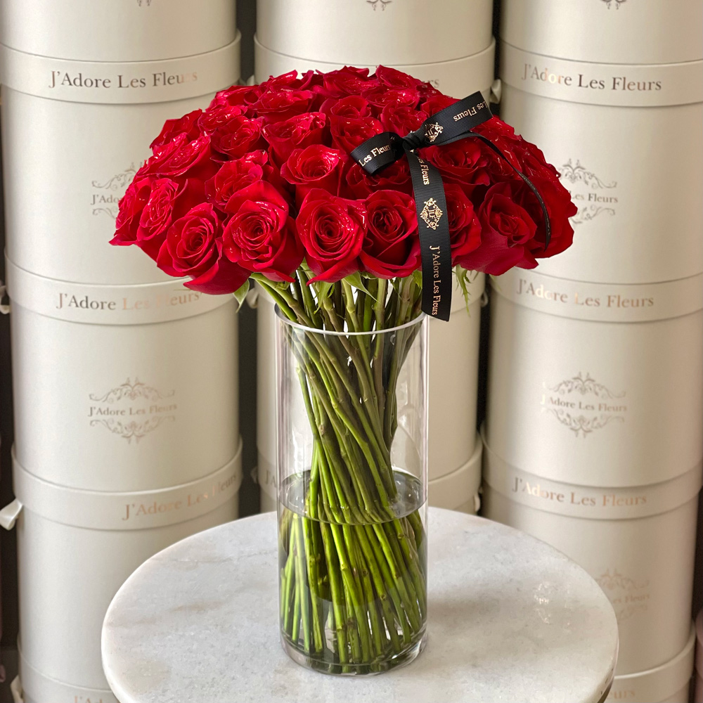 Roses and Stems in a Glass Vase