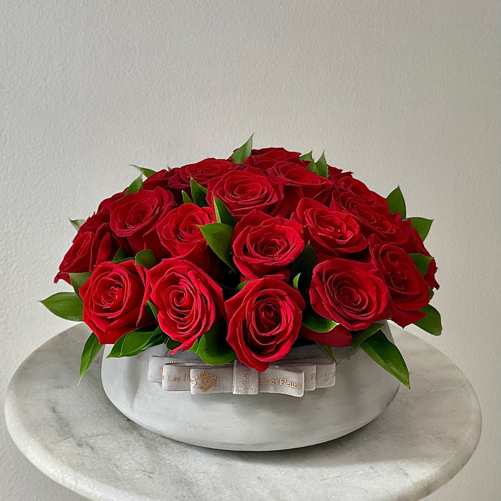 Red Roses in a Ceramic Vase
