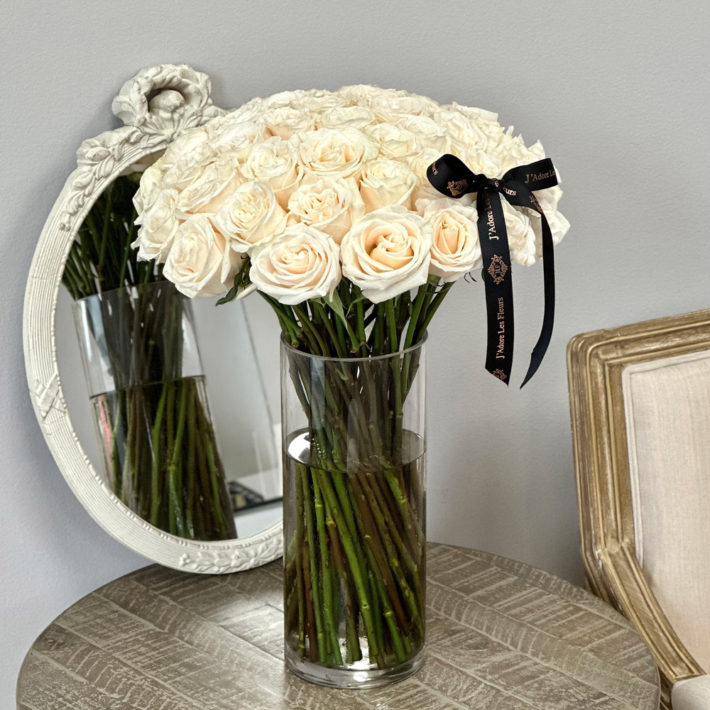 White Roses and Stems in a Glass Vase